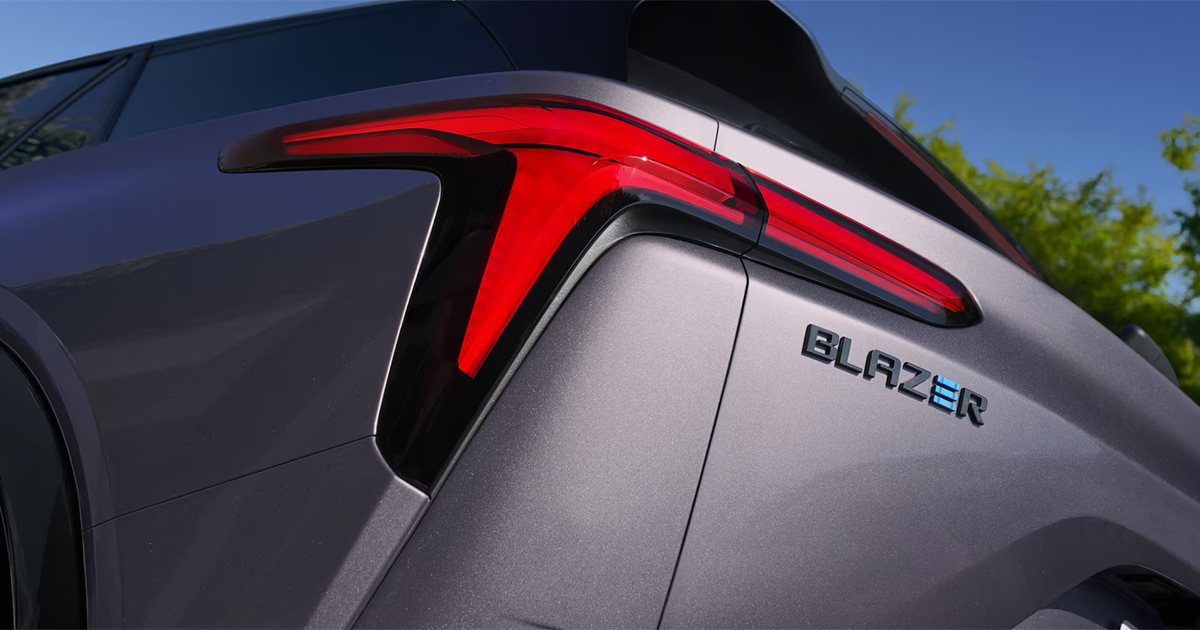 Close-up of Chevrolet Blazer EV rear taillight design and model badge on silver SUV