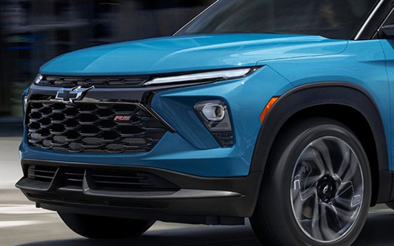 An exterior of a blue #DEALKERMAKE# vehicle